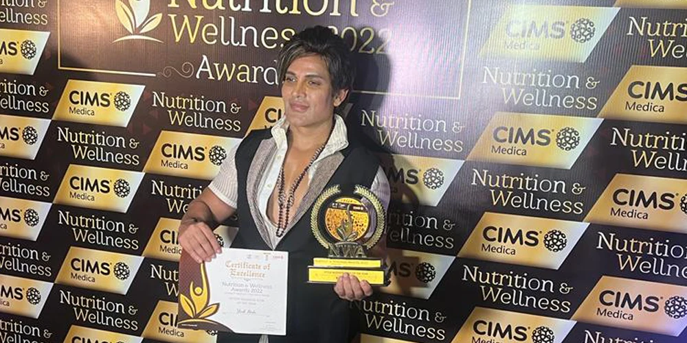 Yash Birla holding certificate and award